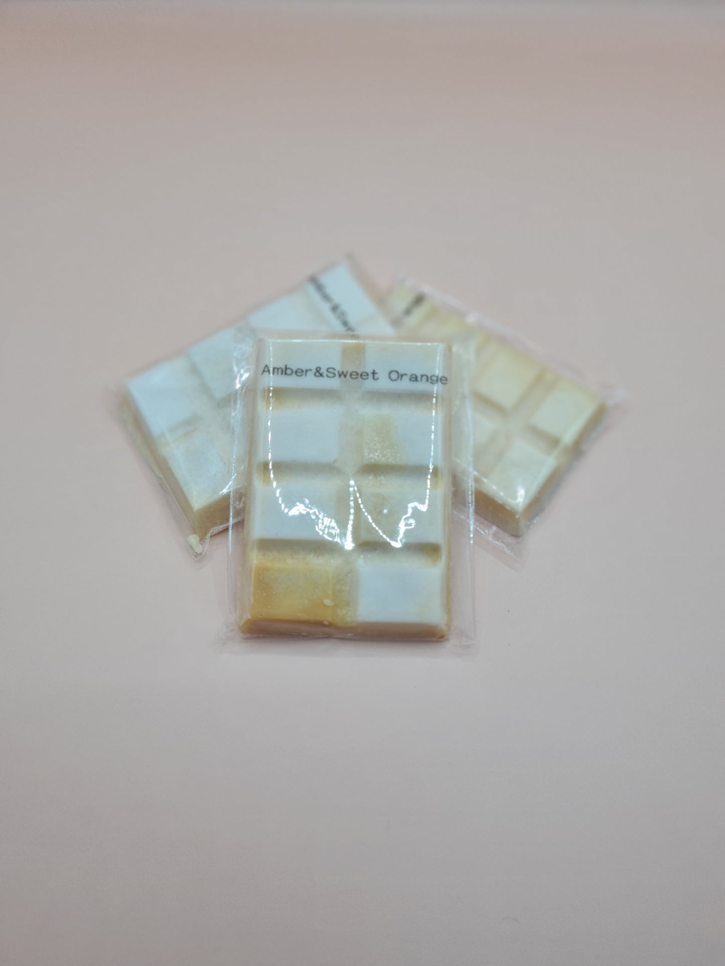 Amber and sweet orange scented snap bar wax melts.